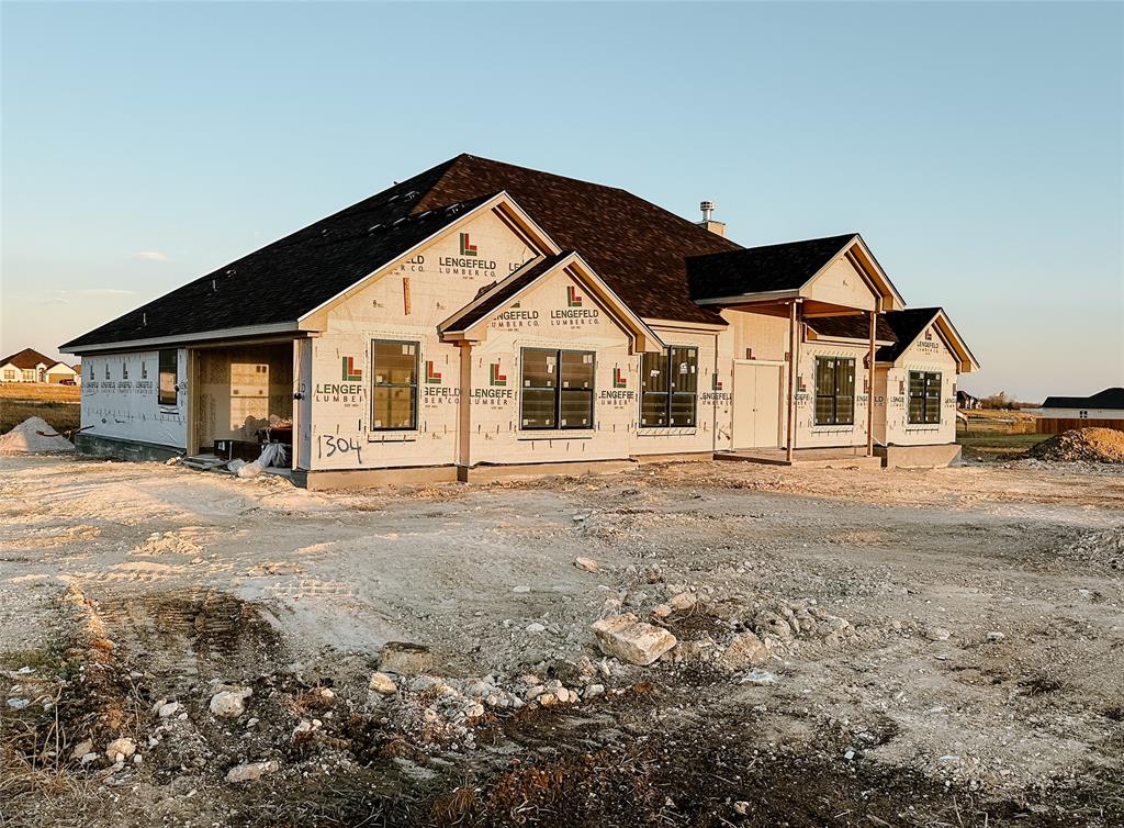 1304 Red Rock Road Hewitt, TX 76643 - Photo 1 of 1 a front view of a house with a yard