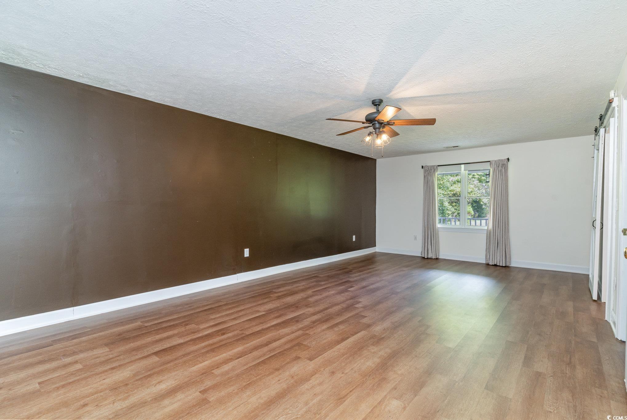 1359 Rodney Road Conway, SC 29526 - Photo 11 of 40 Unfurnished room with ceiling fan, light hardwood