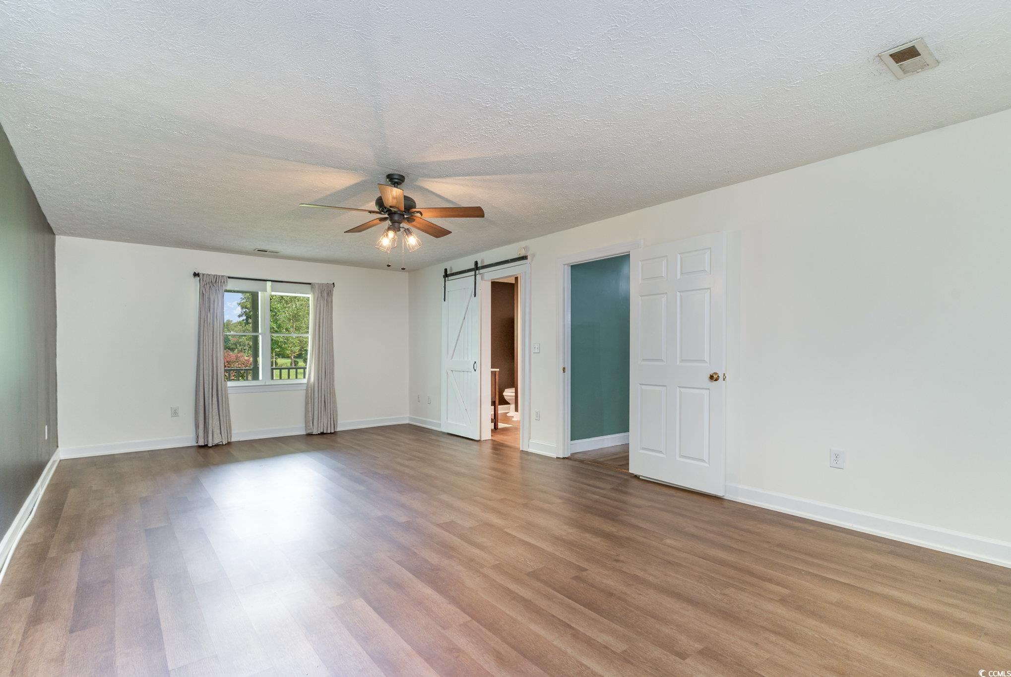 1359 Rodney Road Conway, SC 29526 - Photo 12 of 40 Empty room with ceiling fan, a textured ceiling, a