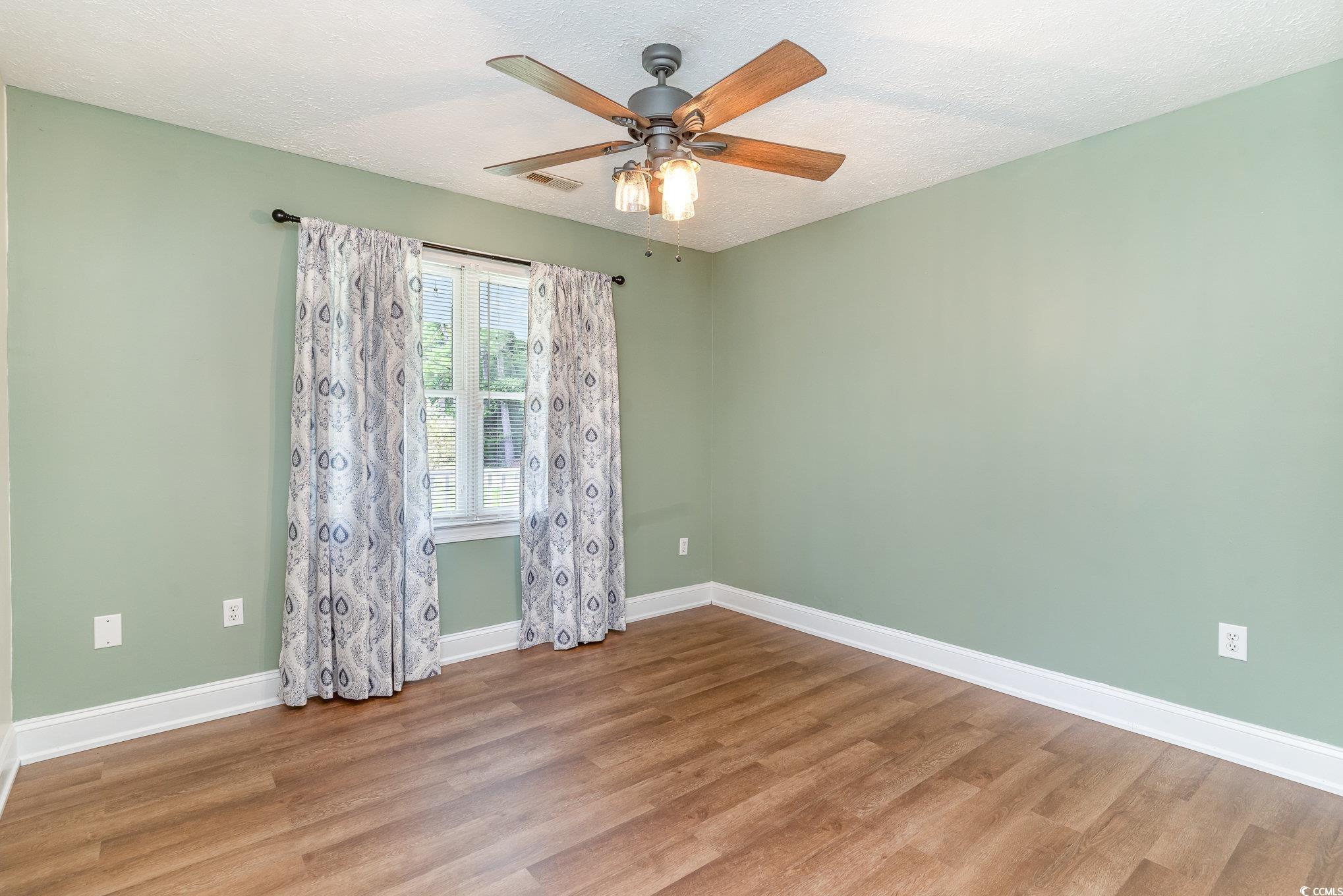 1359 Rodney Road Conway, SC 29526 - Photo 3 of 40 Empty room with a textured ceiling, ceiling fan, a