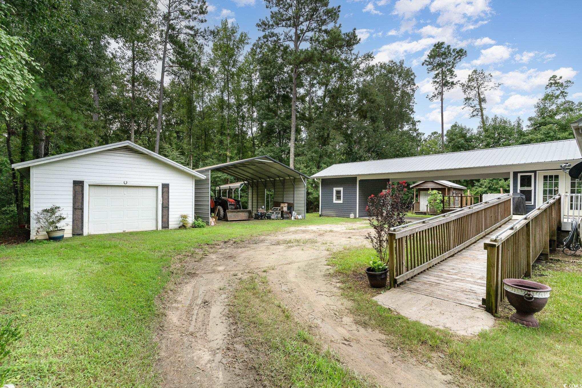 1359 Rodney Road Conway, SC 29526 - Photo 31 of 40 View of yard featuring a carport, an outdoor struc