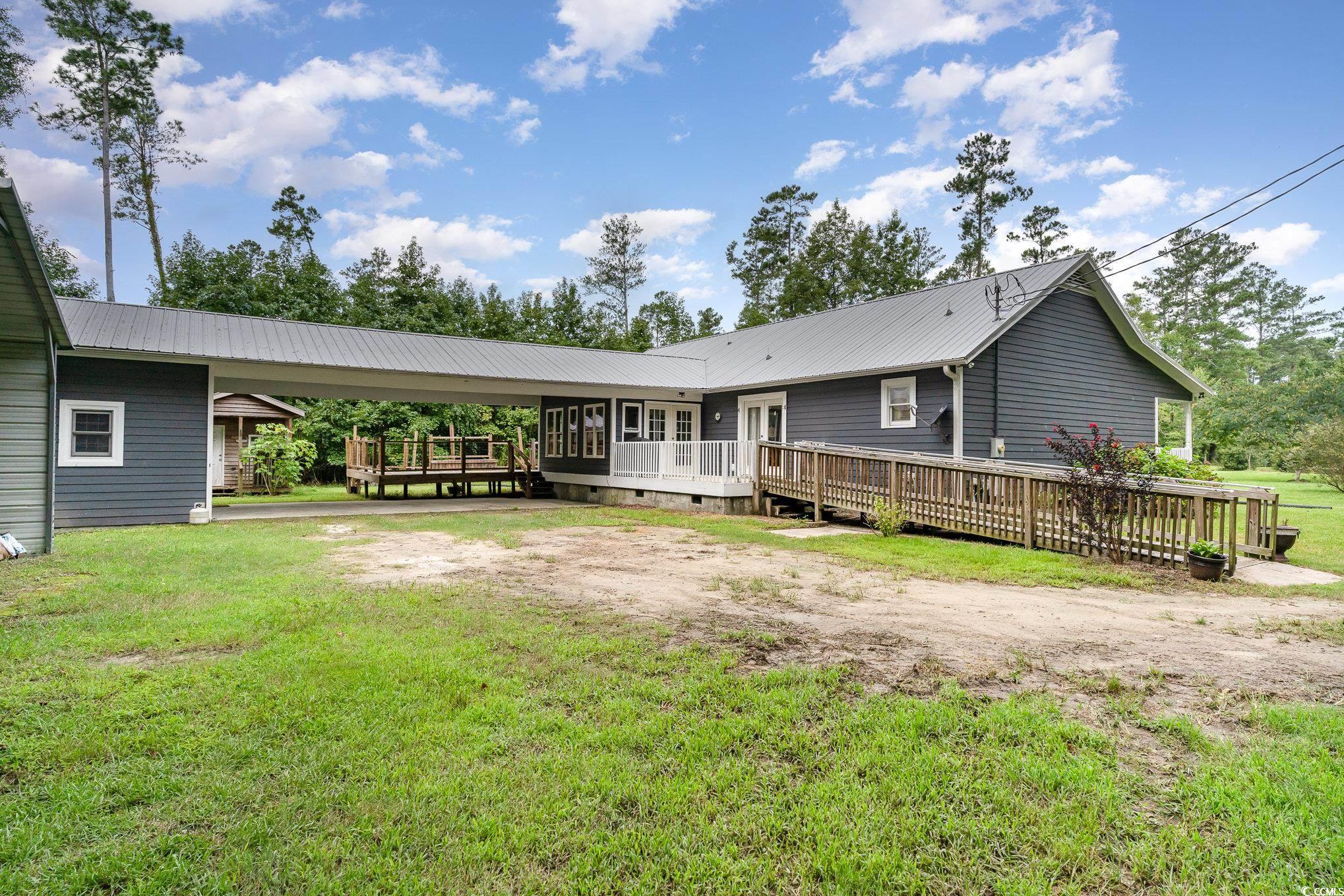 1359 Rodney Road Conway, SC 29526 - Photo 32 of 40 Back of house featuring a lawn and a deck