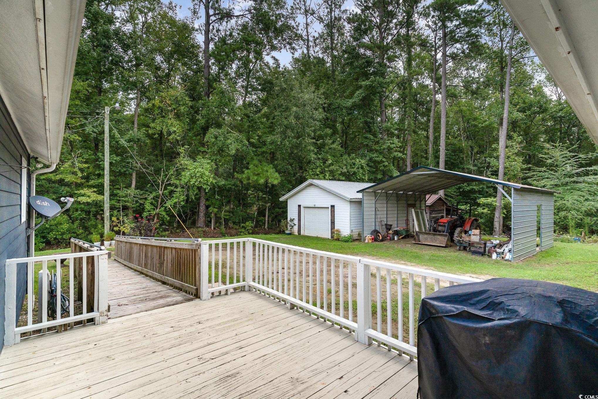 1359 Rodney Road Conway, SC 29526 - Photo 34 of 40 Wooden terrace featuring a carport, a grill, a gar