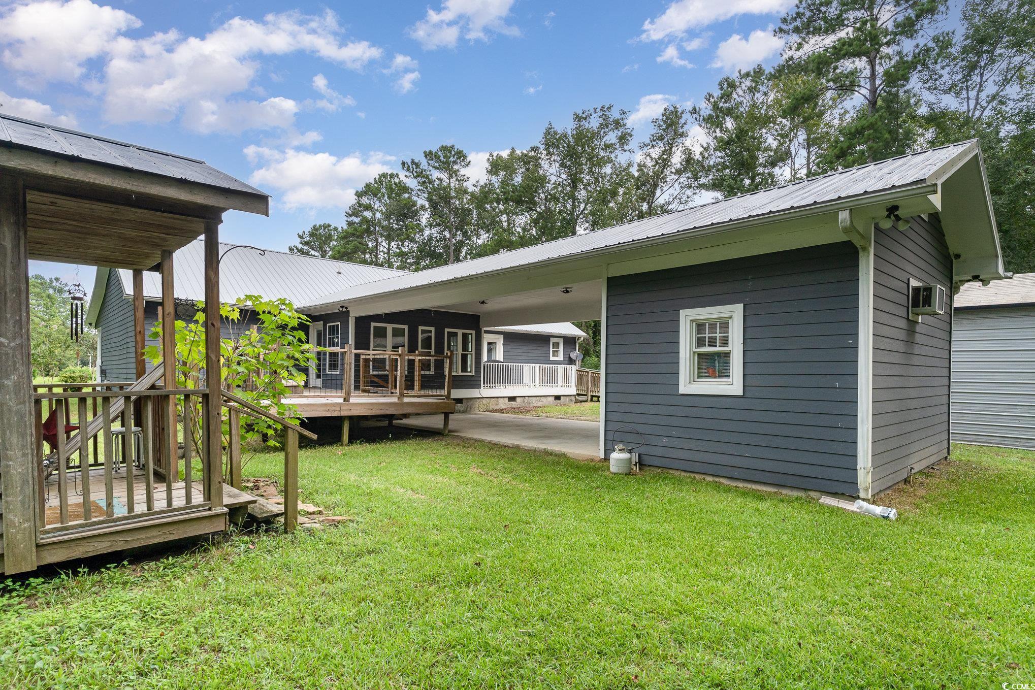 1359 Rodney Road Conway, SC 29526 - Photo 37 of 40 Rear view of house featuring a wooden deck and a l