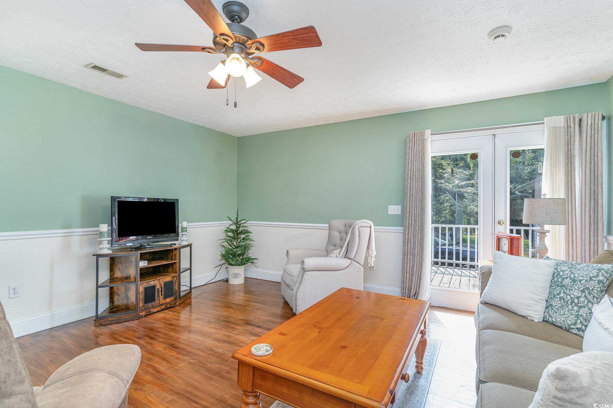 1359 Rodney Road Conway, SC 29526 - Photo 7 of 40 Living room featuring ceiling fan and wood-type fl