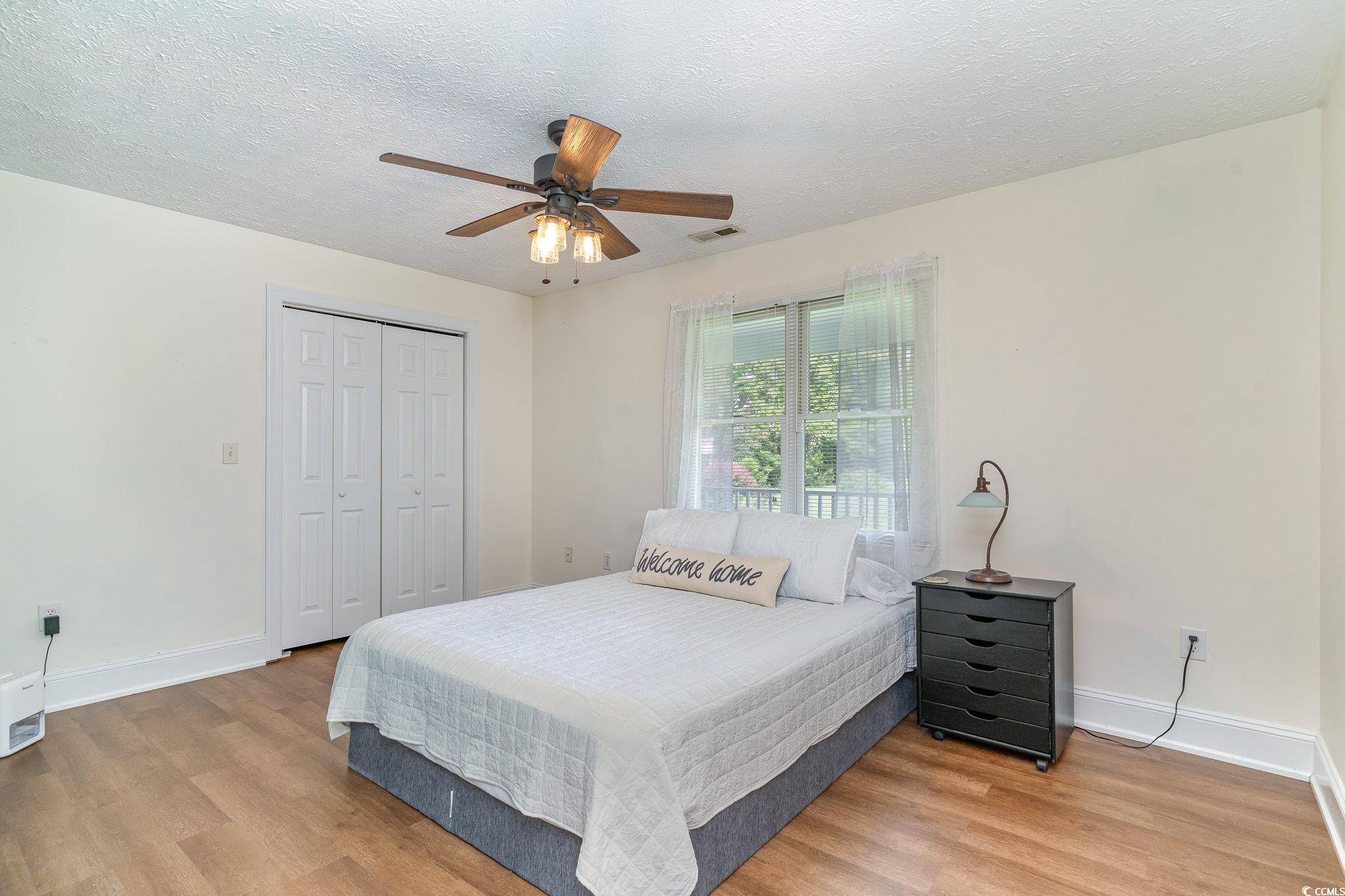 1359 Rodney Road Conway, SC 29526 - Photo 9 of 40 Bedroom featuring ceiling fan, a closet, a texture
