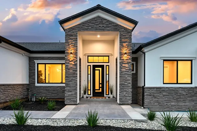 a front view of a house with a yard