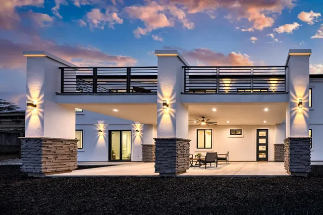 a front view of a house with stairs
