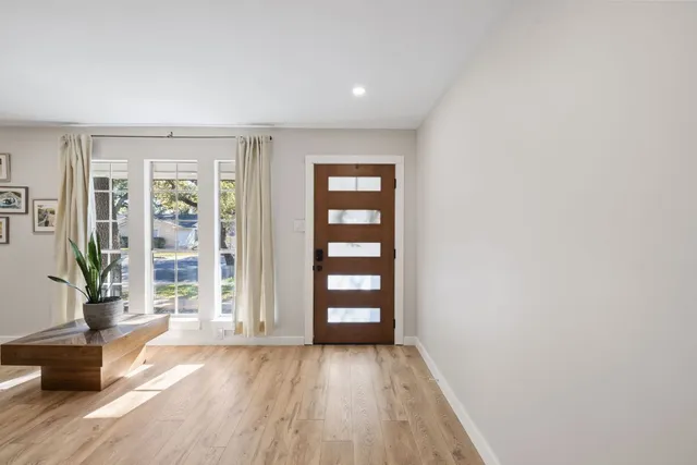 an empty room with wooden floor and wooden floor