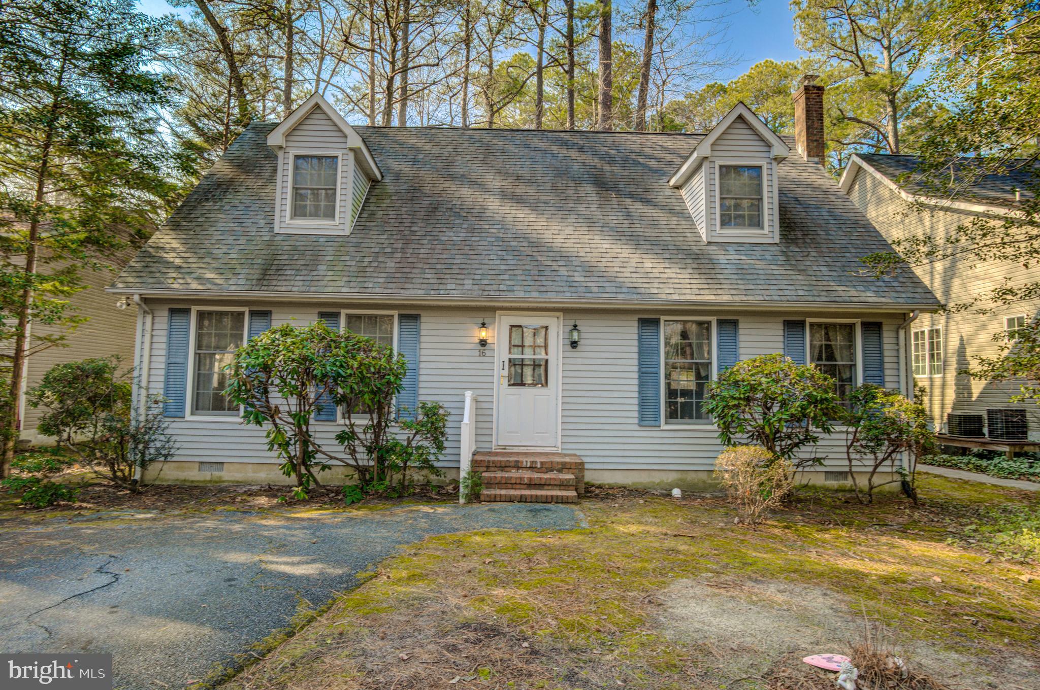 16 Canal Road Ocean Pines, MD 21811 - Photo 1 of 56 a front view of a house with garden