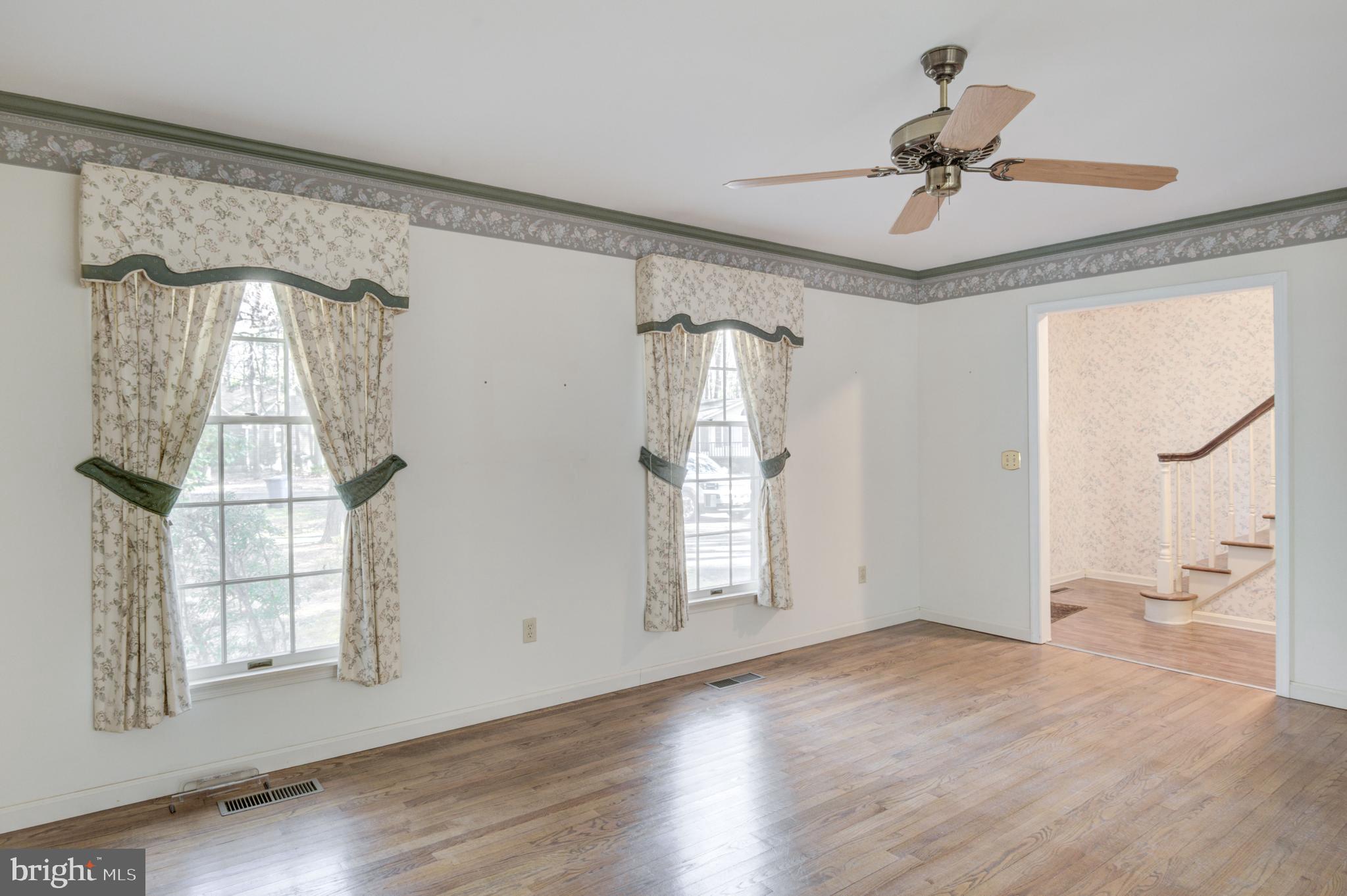 16 Canal Road Ocean Pines, MD 21811 - Photo 13 of 56 a view of empty room with wooden floor and fan