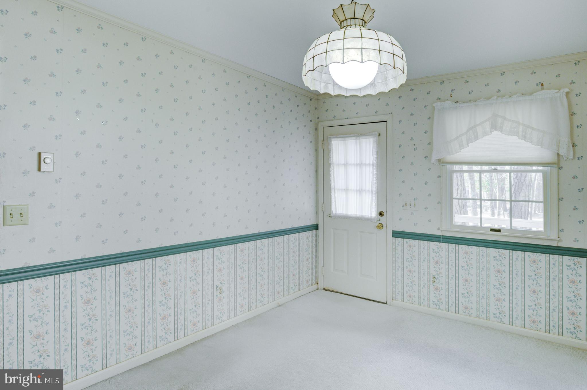 16 Canal Road Ocean Pines, MD 21811 - Photo 15 of 56 a view of an empty room and window