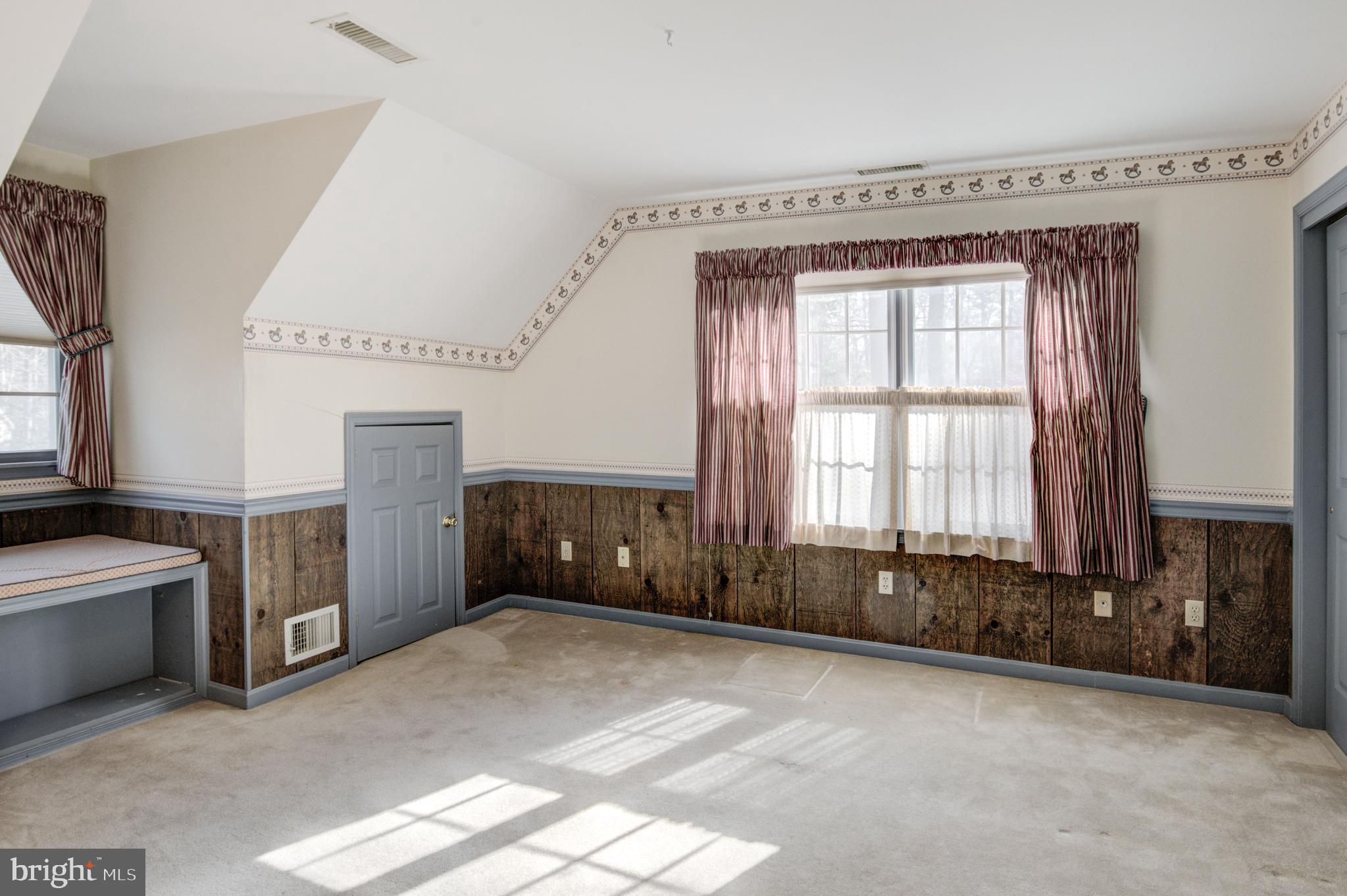 16 Canal Road Ocean Pines, MD 21811 - Photo 28 of 56 a view of an empty room with a fireplace and a window