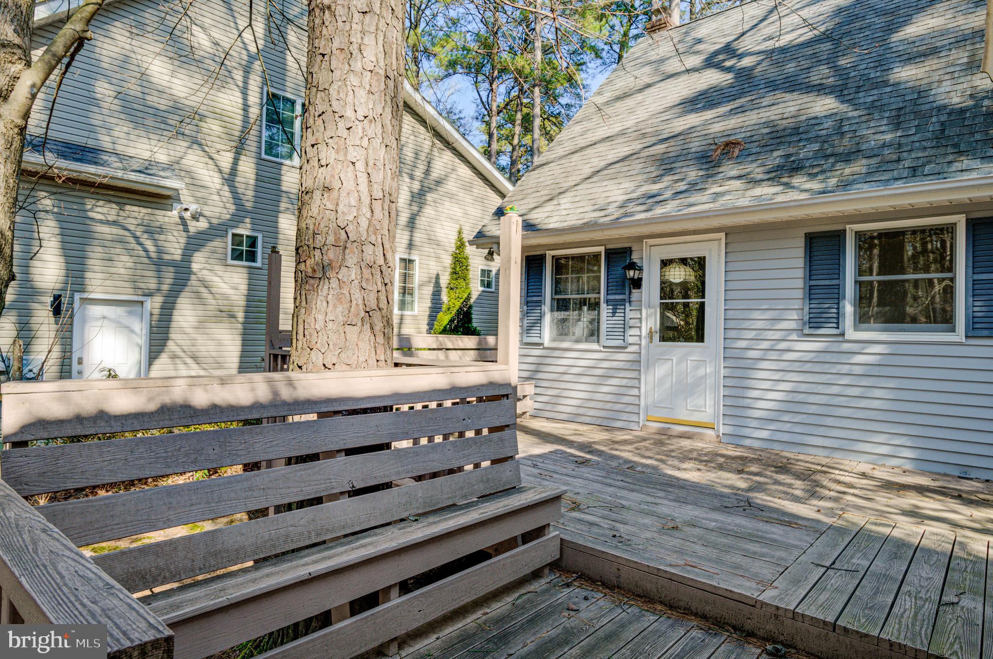 16 Canal Road Ocean Pines, MD 21811 - Photo 45 of 56 a view of a wooden bench on the side of a street