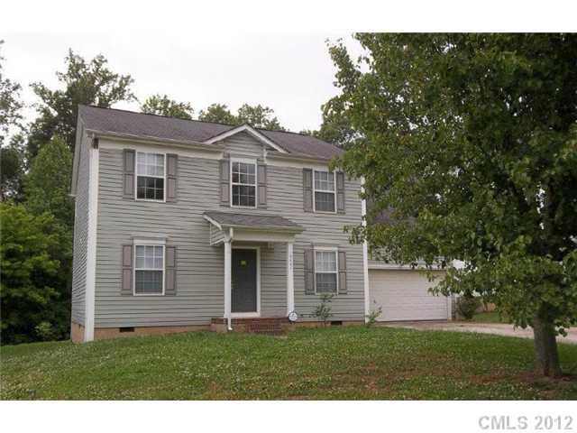 10807 Azure Valley Place Charlotte, NC 28269 - Photo 1 of 13 a front view of a house with a garden