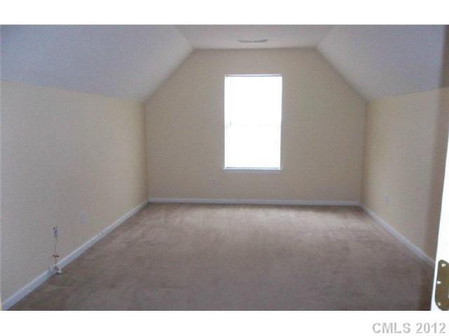 10807 Azure Valley Place Charlotte, NC 28269 - Photo 7 of 13 a view of an empty room with a window