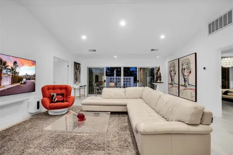 a view of kitchen with stainless steel appliances cabinets and wooden floor
