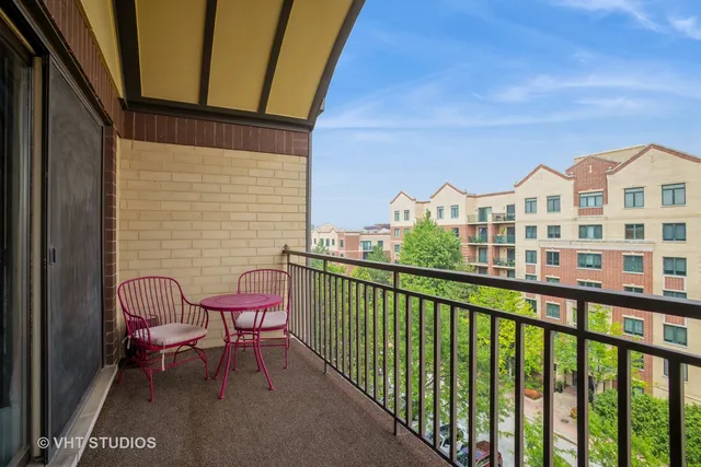 a view of a chair and table in the balcony