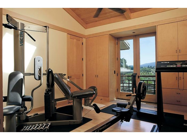 150 Farm Road Woodside, CA 94062 - Photo 17 of 19 a view of a workspace with furniture and floor to ceiling window
