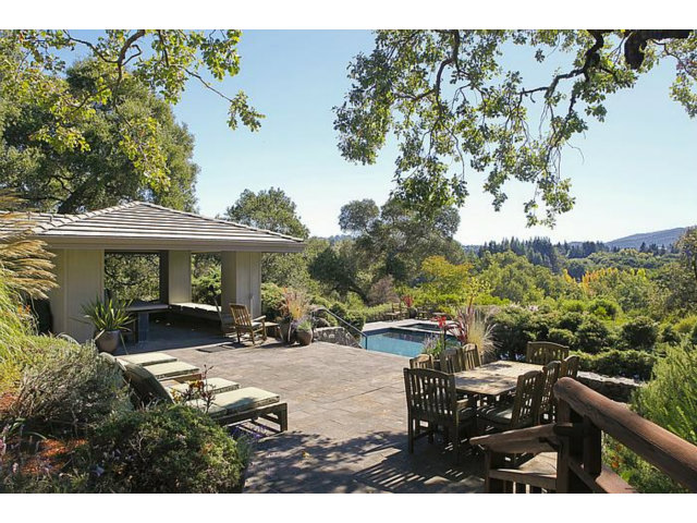 150 Farm Road Woodside, CA 94062 - Photo 2 of 19 a view of a patio with table and chairs with wooden fence