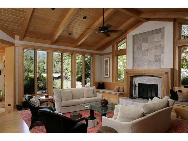 150 Farm Road Woodside, CA 94062 - Photo 7 of 19 a living room with furniture a fireplace and floor to ceiling window