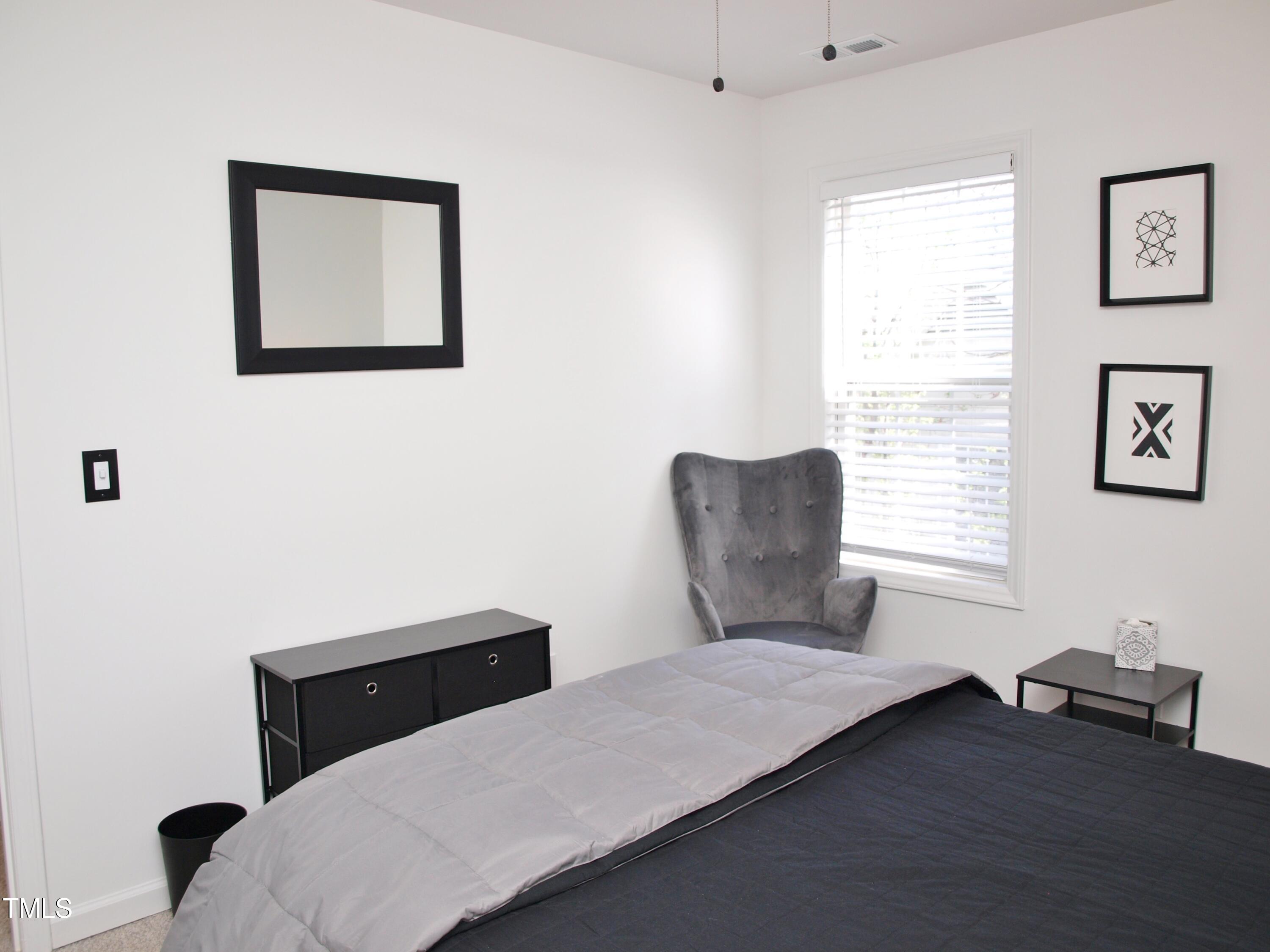 4500 Bartholomew Circle Raleigh, NC 27604 - Photo 13 of 22 a bedroom with furniture and a window