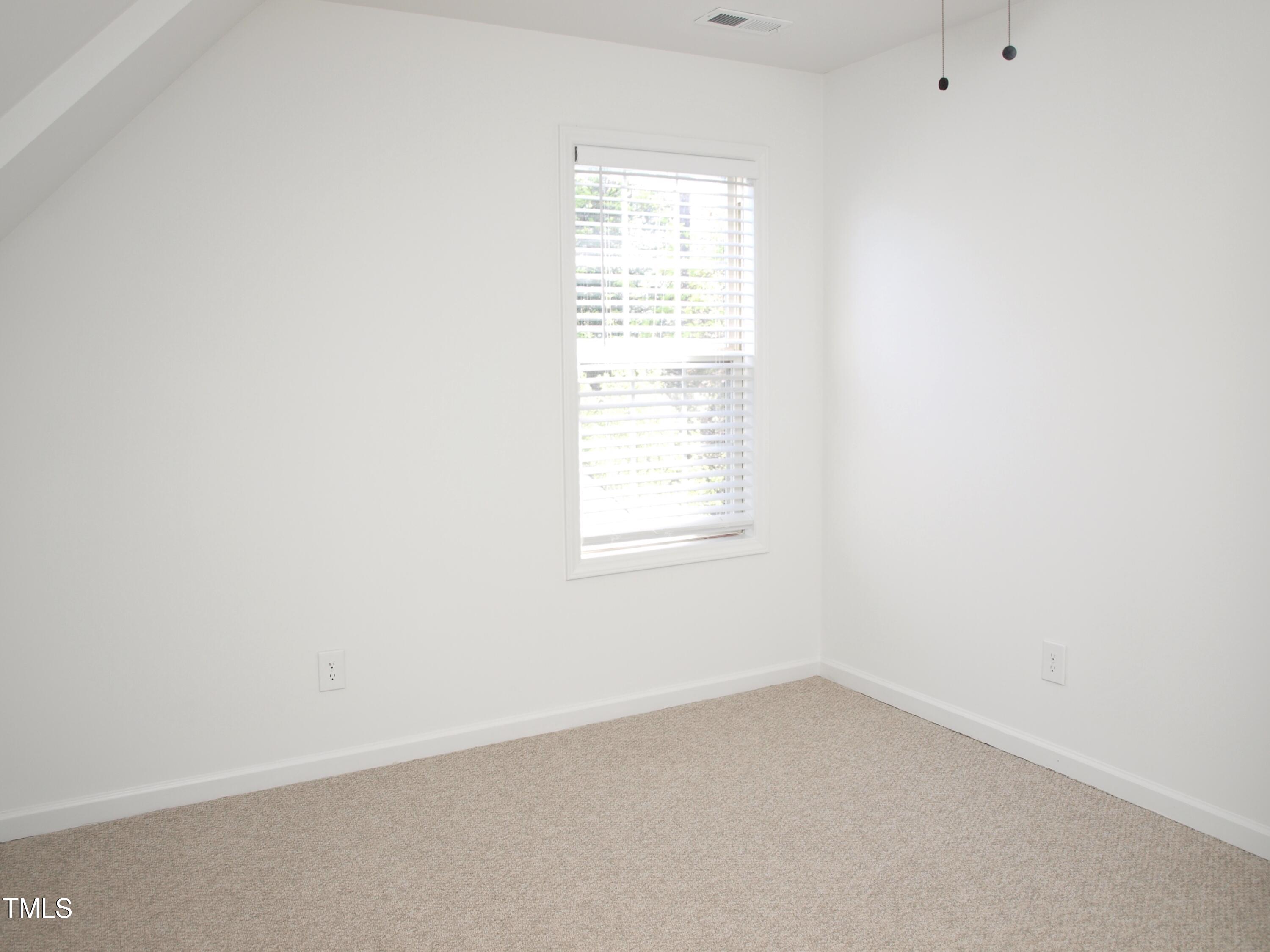 4500 Bartholomew Circle Raleigh, NC 27604 - Photo 16 of 22 an empty room with a window