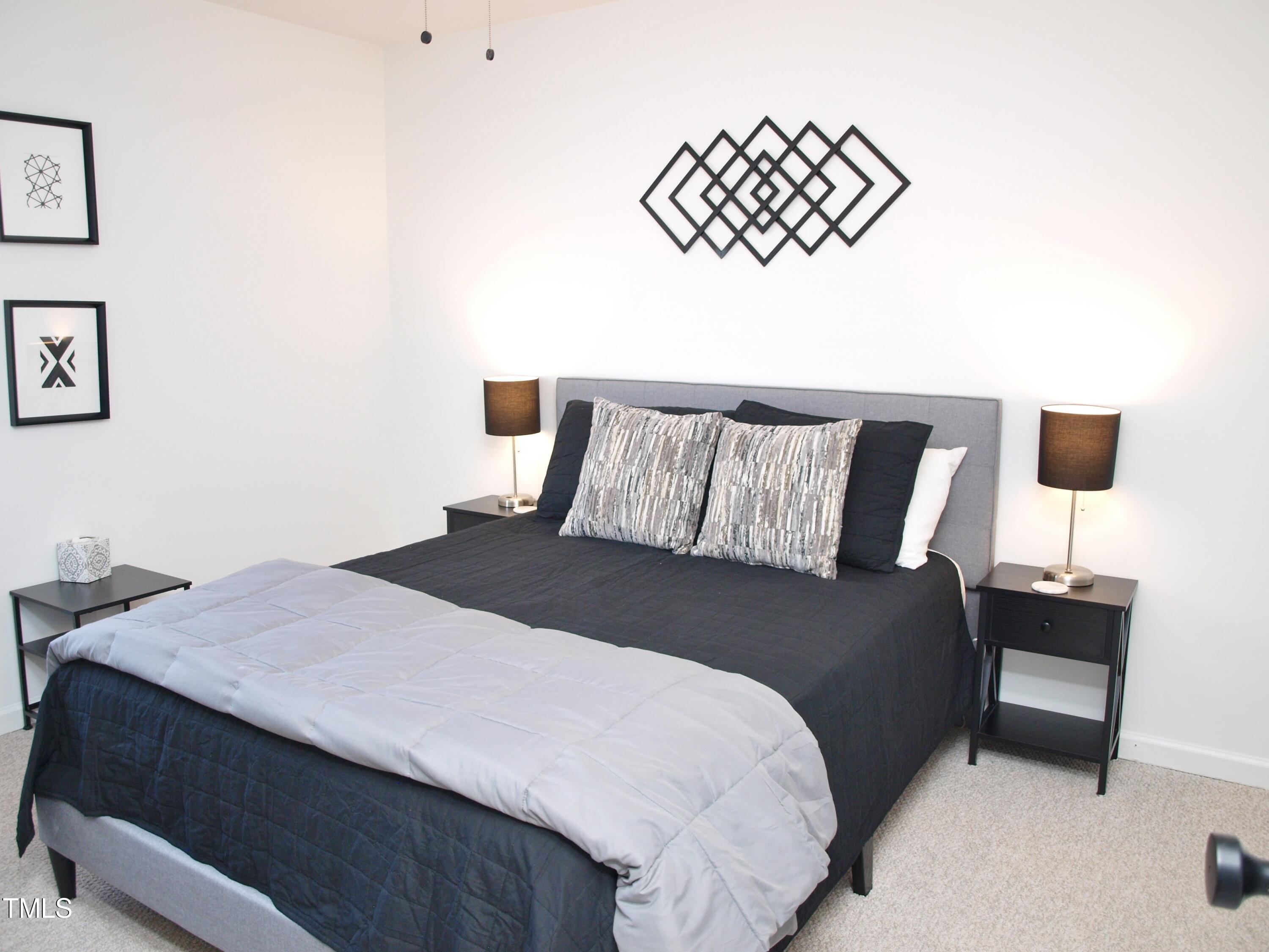 4500 Bartholomew Circle Raleigh, NC 27604 - Photo 9 of 22 a bedroom with a bed and a wall painting