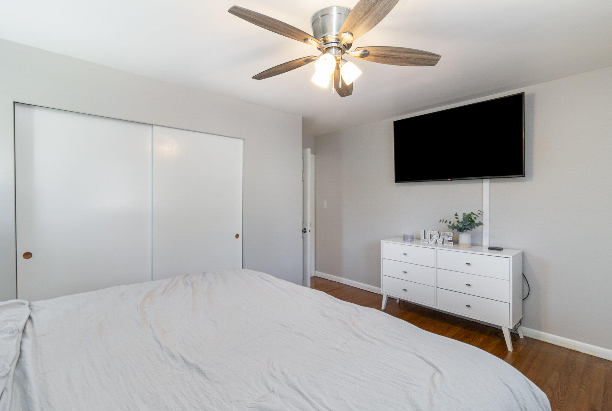3131 Wirth Road Highland, IN 46322 - Photo 17 of 31 a bedroom with a bed a window and a flat screen tv