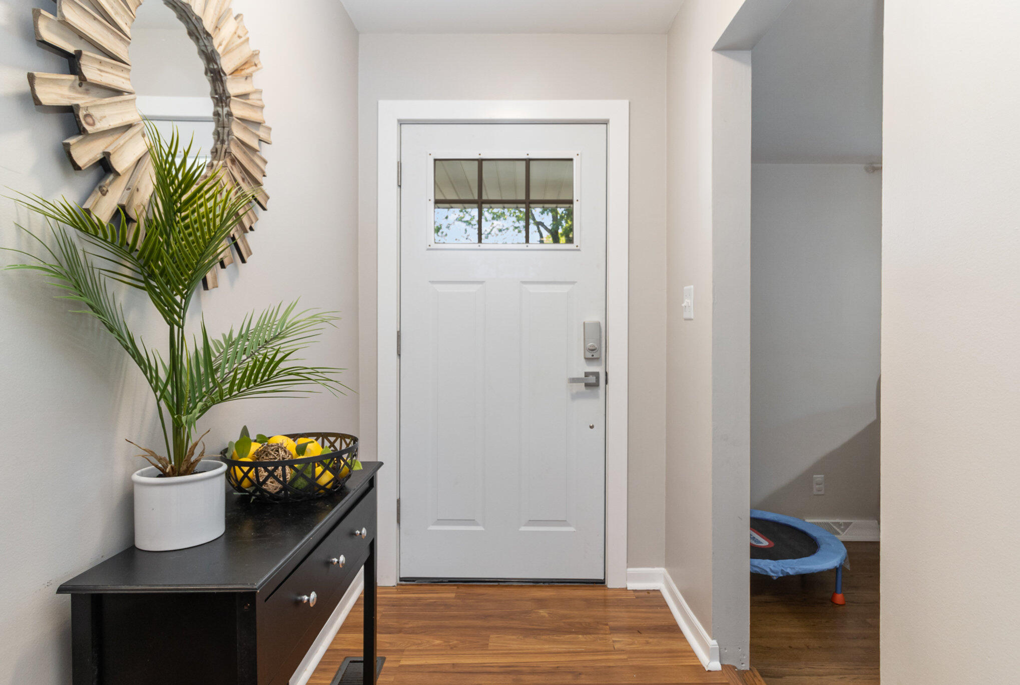 3131 Wirth Road Highland, IN 46322 - Photo 6 of 31 a view of a hallway with wooden floor and a potted plant