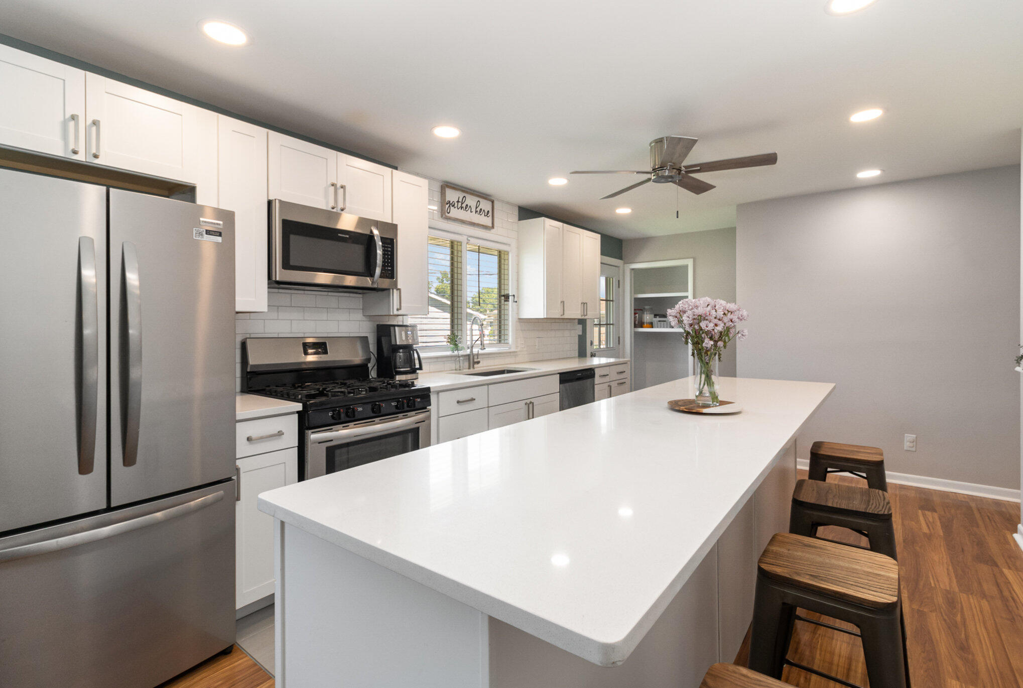 3131 Wirth Road Highland, IN 46322 - Photo 9 of 31 a kitchen with stainless steel appliances a sink a stove a refrigerator cabinets and a dining table