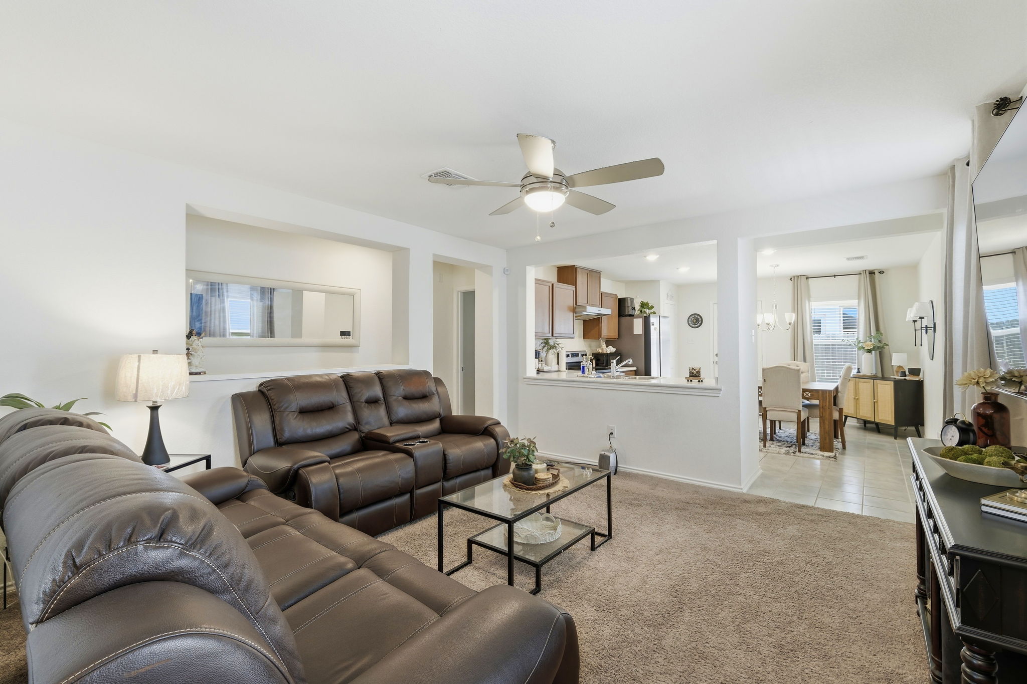 220 Lucky Texan Road Jarrell, TX 76537 - Photo 18 of 19 An inviting open floorplan connects the living area to the kitchen and dining space, perfect for everyday living.