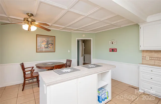a dining room with a table and chairs