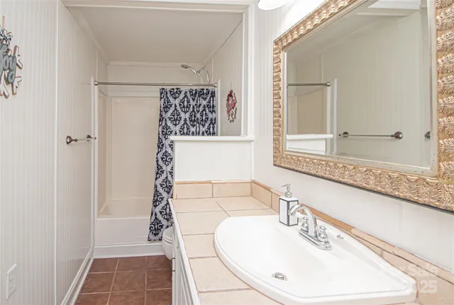 a utility room with cabinets washer and dryer