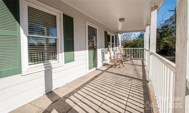 a view of a balcony with wooden floor