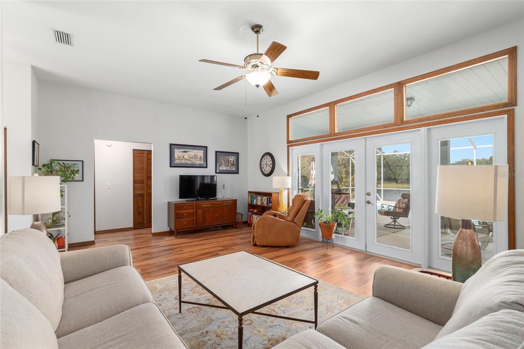 12094 Southeast 60th Avenue Road Belleview, FL 34420 - Photo 16 of 74 a living room with furniture and a large window