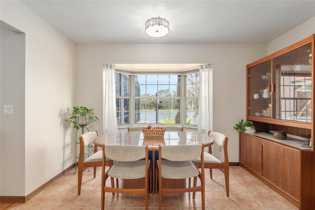 12094 Southeast 60th Avenue Road Belleview, FL 34420 - Photo 19 of 74 a dining room with furniture and window