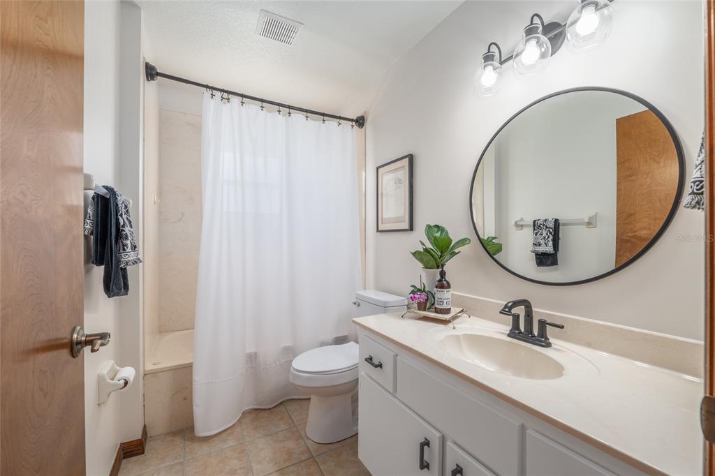 12094 Southeast 60th Avenue Road Belleview, FL 34420 - Photo 38 of 74 a bathroom with a sink and a mirror