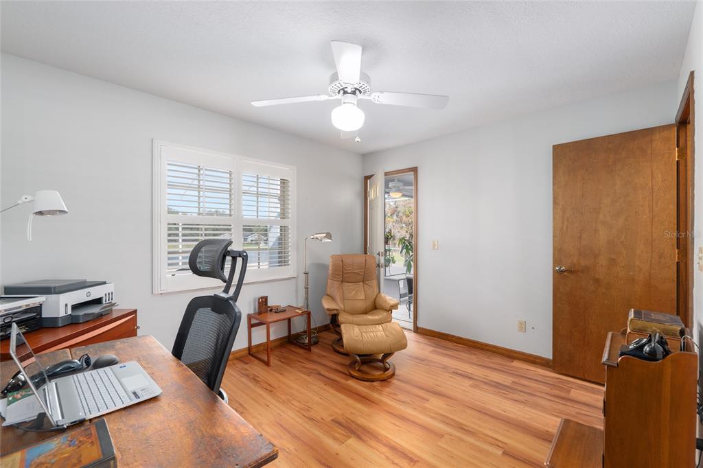 12094 Southeast 60th Avenue Road Belleview, FL 34420 - Photo 40 of 74 a view of a workspace with furniture and a window