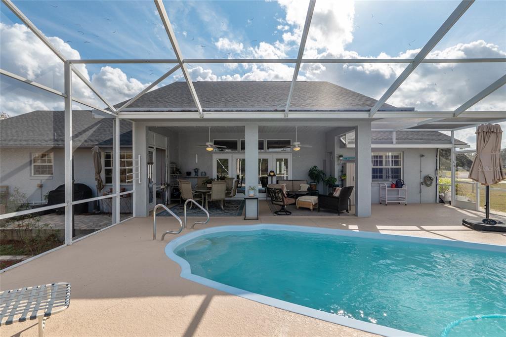 12094 Southeast 60th Avenue Road Belleview, FL 34420 - Photo 48 of 74 a view of a chairs and table in a patio