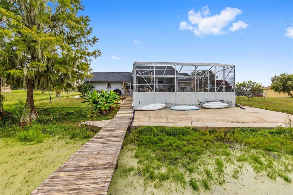 12094 Southeast 60th Avenue Road Belleview, FL 34420 - Photo 56 of 74 a front view of a house with a yard