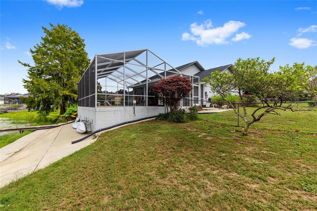 12094 Southeast 60th Avenue Road Belleview, FL 34420 - Photo 59 of 74 a view of a house with a yard