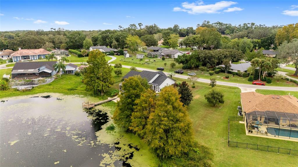 12094 Southeast 60th Avenue Road Belleview, FL 34420 - Photo 61 of 74 an aerial view of residential houses with outdoor space