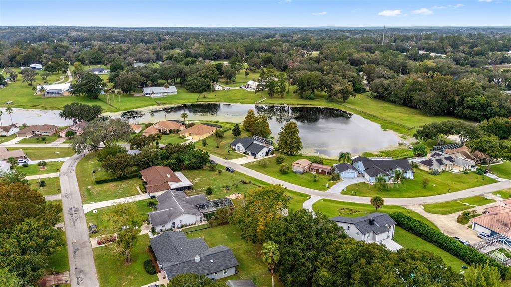 12094 Southeast 60th Avenue Road Belleview, FL 34420 - Photo 64 of 74 an aerial view of a house with a garden