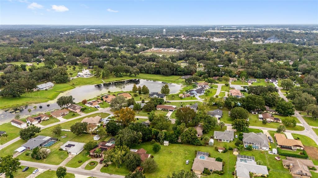 12094 Southeast 60th Avenue Road Belleview, FL 34420 - Photo 66 of 74 an aerial view of residential houses with outdoor space