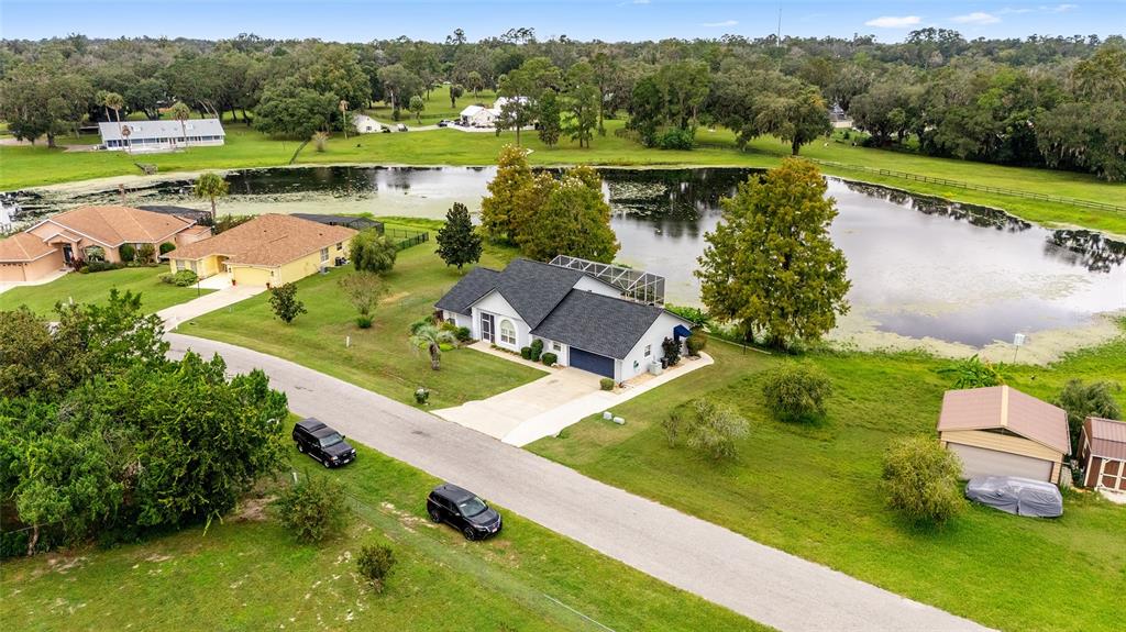 12094 Southeast 60th Avenue Road Belleview, FL 34420 - Photo 70 of 74 an aerial view of a house with outdoor space