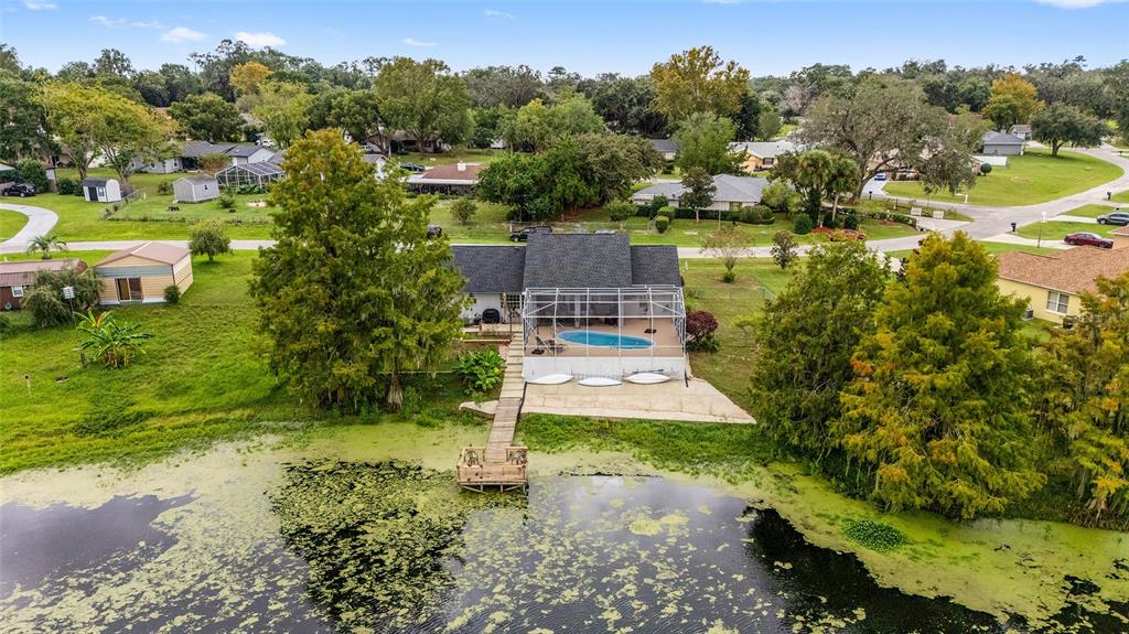 12094 Southeast 60th Avenue Road Belleview, FL 34420 - Photo 72 of 74 an aerial view of residential house with outdoor space