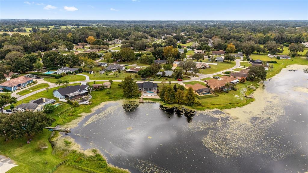 12094 Southeast 60th Avenue Road Belleview, FL 34420 - Photo 74 of 74 an aerial view of residential houses with outdoor space