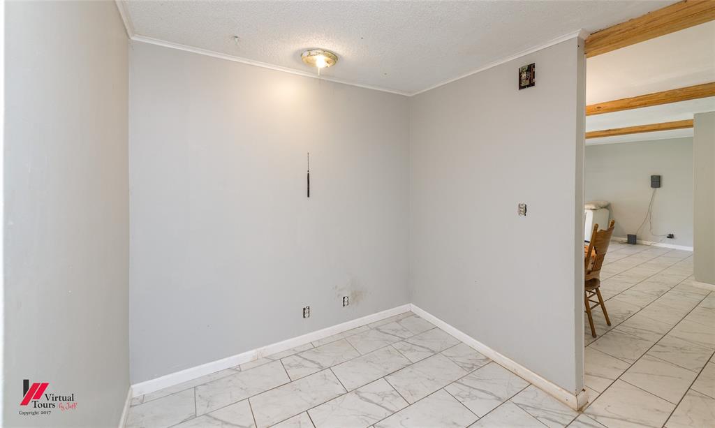 423 11th Street Northeast Springhill, LA 71075 - Photo 17 of 24 Light grey painted walls with white trim and a ceiling-mounted light fixture