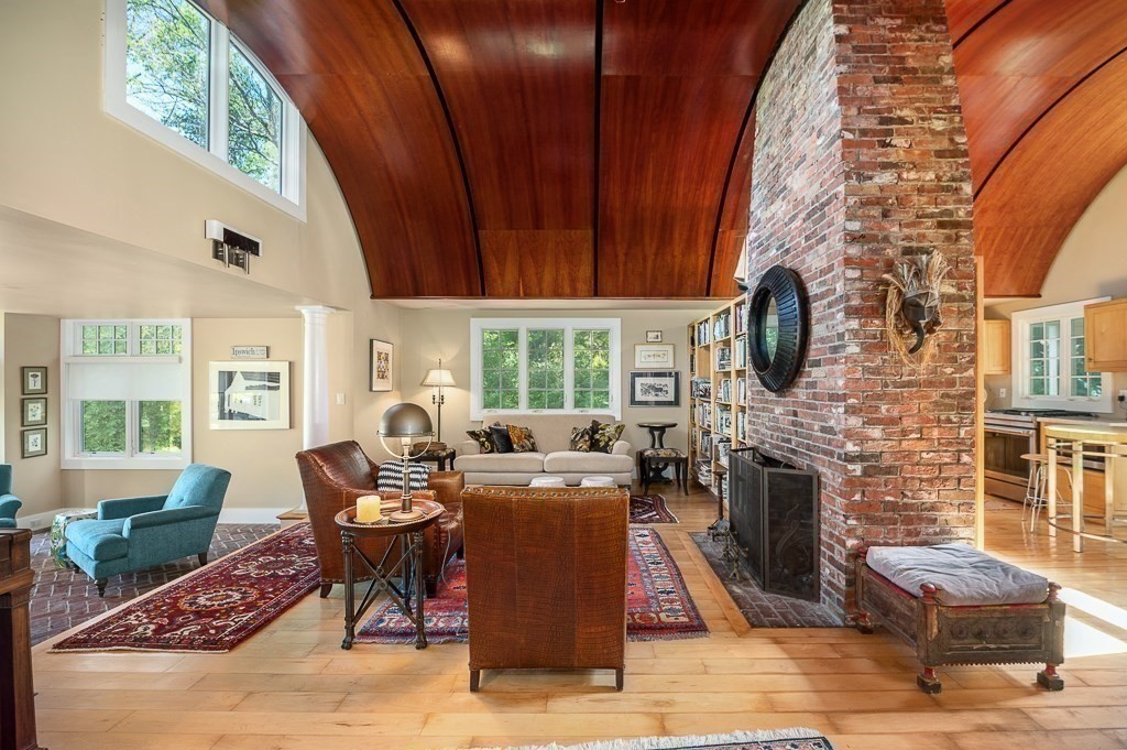 172 Argilla Road Ipswich, MA 01938 - Photo 16 of 34 a living room with fireplace furniture and a flat screen tv